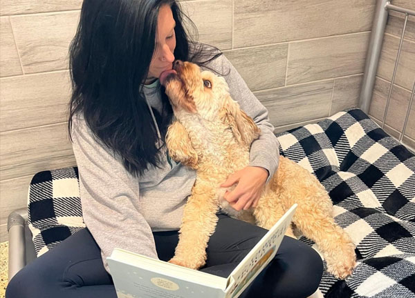 dog-boarding-image-1 Reading a bedtime story to a dog