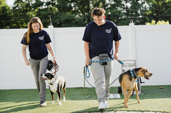 Dog trainers with two dogs